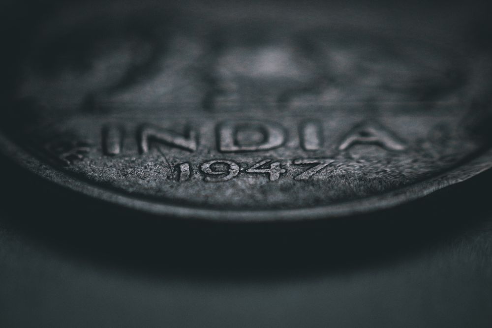Antique silver coin shown in macro, read for date and mint mark